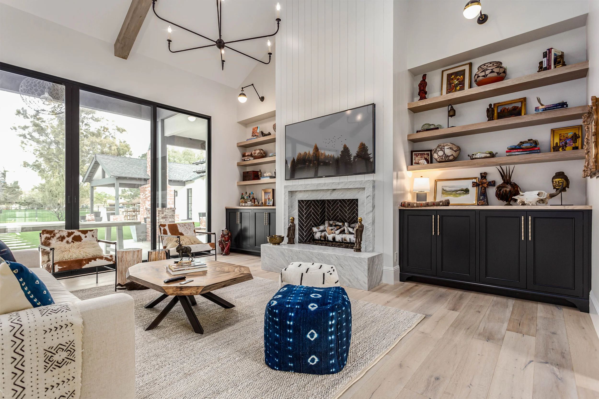 Custom built-in bookcases and entertainment center with walnut cabinetry in Brentwood
